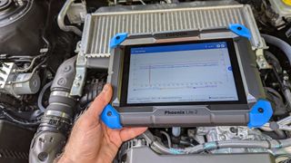 topdom phoenix lite 2 obd2 scanner over car engine