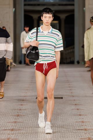 Wales Bonner S/S 2025 runway show featuring model in swim trunks and polo shirt