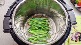 Instant Pot Pro with steamed vegetables