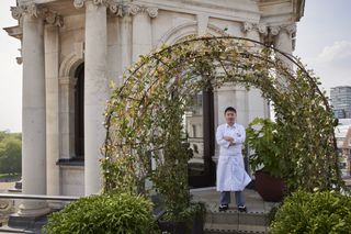 chef Endo Kazutoshi outside at Kioku beside planted arch