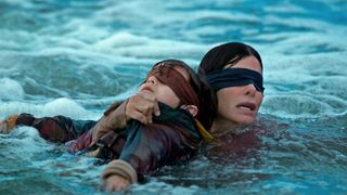 Sandra Bullock and Rosa Salazar in Bird Box, one of the best horror movies on Netflix