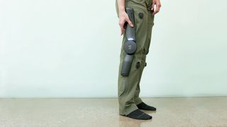 Arc'teryx MO/GO electric hiking pants on a user wearing them out in nature