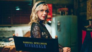 Kiernan Shipka, in a Riverdale-branded seat, will appear as Sabrina Spellman in Riverdale season 6