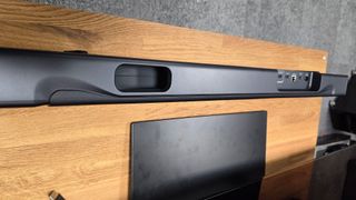 JBL Bar 300 soundbar shot from above on TV stand