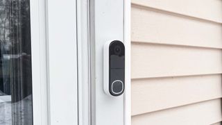 Arlo Video Doorbell 2K attached to house