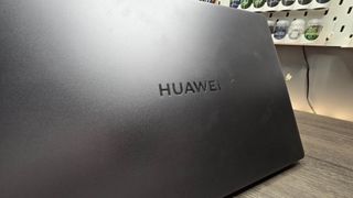 The Huawei MateBook D 16 on a wooden desk