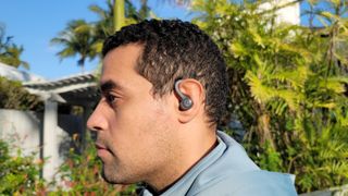 The JLab Go Air Sport wireless earbuds being worn during a workout