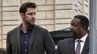 (L to R) John Krasinski (as Jack Ryan) and Wendell Pierce (as James Greer) look at each other on the street in Jack Ryan season 3