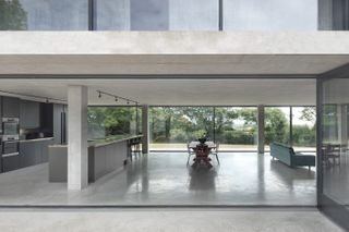 Castle High by Hyde + Hyde Architects outside looking into the living room through large window