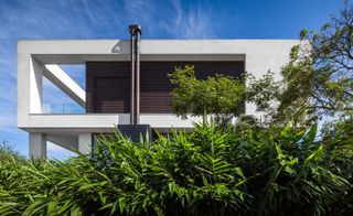 Exterior of the house revealing the corner of the terrace