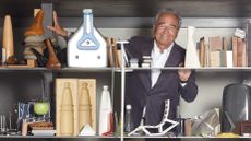 Alberto Meda portrait with shelves of work