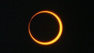 The moon obscures the sun during an annular eclipse