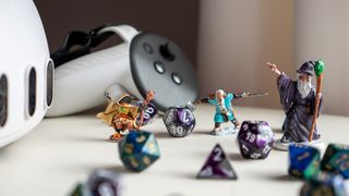 A Meta Quest 3 headset with controller alongside Dungeons and Dragons dice and characters