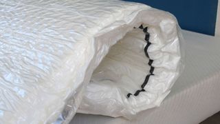 An unboxed mattress ordered from Amazon during Prime Day still in its plastic packaging 