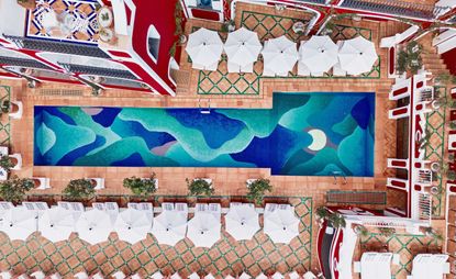 A swimming pool made of blue and green mosaic tiles at Le Sirenuse