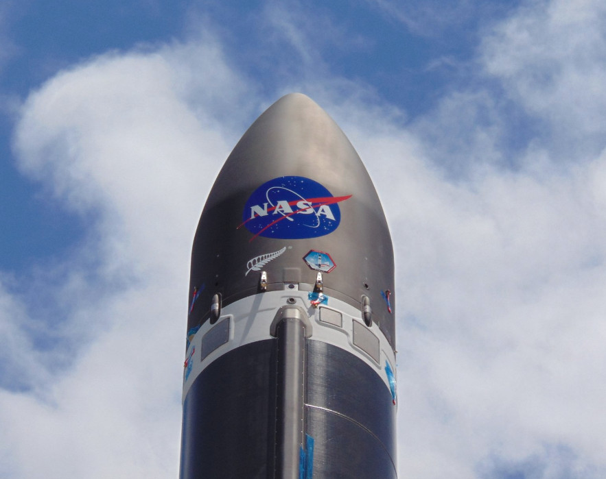 A Rocket Lab Electron booster is decked out with a big NASA logo ahead of the company&#039;s first launch for the U.S. space agency from its New Zealand launch site, on the North Island&#039;s Mahia Peninsula. Liftoff is scheduled for Dec. 12, 2018.