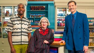 "Great British Sewing Bee" host Kiell Smith-Bynoe alongside judges Esme Young and Patrick Grant in a promotional image for season 10