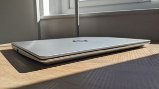 The Framework Laptop Chromebook Edition photographed on a wooden desk.