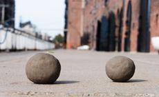 Landscape image for Bosco Sodi's Tabula Rasa – two clay spheres outside the artist's Red Hook, Brooklyn studio