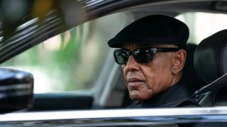 Gray Parish (Giancarlo Esposito), wearing dark sunglasses and a cap, stares from a car window in "Parish"