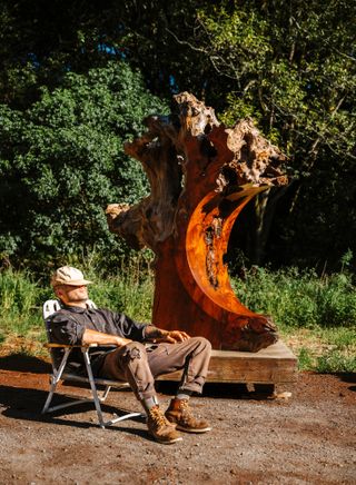 Ido Yoshimoto's workshop in Inverness, California, photographed under a blue sky and with wooden elements from his production