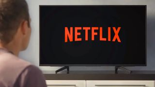 Man watching Netflix on TV