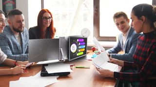 FOPO triple laptop extender being used in a meeting