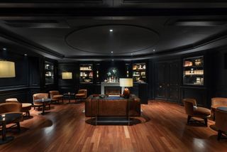 Hotel Casa Lucía, dark lounge area with wooden floor