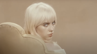 Billie Eilish staring down camera in Happier Than Ever promotional video 