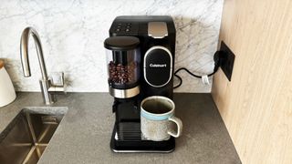 Cuisinart Grind and Brew Single Serve with a marble backsplash