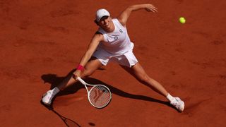 Iga Swiatek plays a shot at the French Open