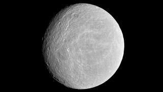 a light grey moon with some craters against a black background.