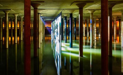 projector and translucent screen surrounded by pillars