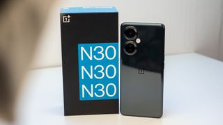 The shiny back of the OnePlus Nord N30 5G next to its box