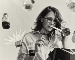 Christine Nagel sniffs scent, amid superimposed bottles of perfume