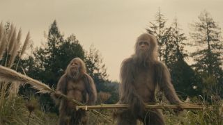 Sasquatches hold fronds in Sasquatch Sunset