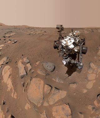 Perseverance took a selfie next to its biggest accomplishment yet – the two small drill holes where the rover took samples of Martian rocks.