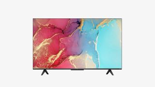 A TCL RC630K Series TV on a white background. On screen is a cracked surface daubed in pale blue, red, white and yellow paint.