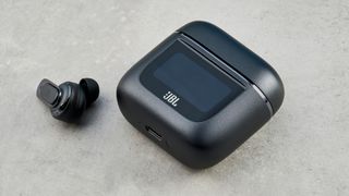 A pair of JBL Tour Pro 2 wireless earbuds in black