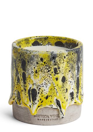 Bottega Veneta scented candle with a yellow ceramic pot