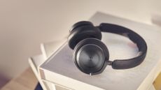 Beoplay HX headphones sitting on table