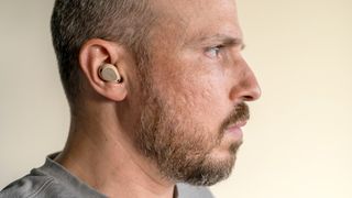 Wearing the Jabra Elite 10 earbuds.