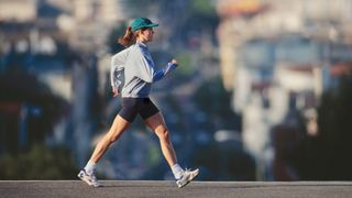 a photo of a woman power walking