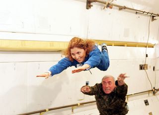 Ansari X Prize backer Anousheh Ansari gets a push during weightless training aboard a modified aircraft. She flew to the ISS on Sept. 18, 2006 - the world's first female private spaceflyer.