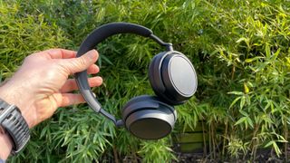 Sennheiser Accentum Plus Wireless noise cancelling over-ears held in hand