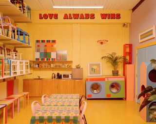 Colourful communal kitchen and dining space inside Yinka Ilori London office