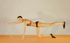 woman stretching in Prism London bra and underwear