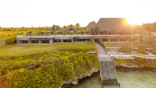 bamboo zanzibar boutique hotel with wooden staircase to sea