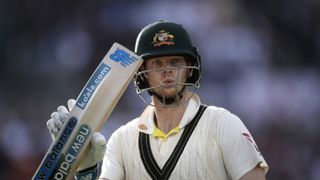 From England v Australia - 4th Specsavers Ashes Test: Day Four MANCHESTER, ENGLAND - SEPTEMBER 07: Steve Smith of Australia raises his bat as he leaves the ground after being dismissed for 82 runs during day four of the 4th Specsavers Test between England and Australia at Old Trafford on September 07, 2019 in Manchester, England