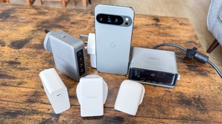 Google Pixel 9 Pro XL with six different chargers